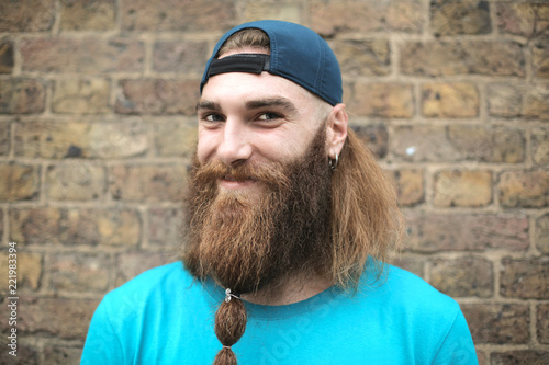 Portrait Of An Handsome Guy With Long Hair And Long Beard