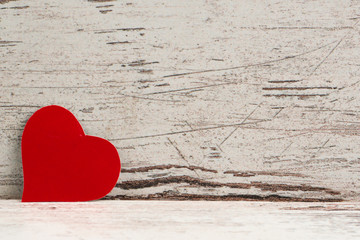  red Love heart on white-painted wooden texture background with  copyspace