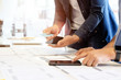 © bongkarn - Team programming ux design designing mobile applications on the phone template.