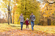 © Syda Productions - family, season and people concept - happy mother, father and little daughter walking at autumn park