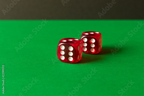 фотография Dice on a green background . Game concept. Games of chance