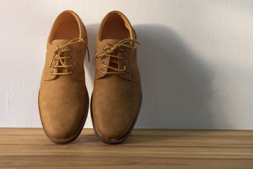 Brown cut leather shoes on wooden floor,Vintage style