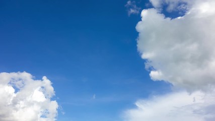 Wall Mural - 4k clouds moving on clear blue sky timelapse.