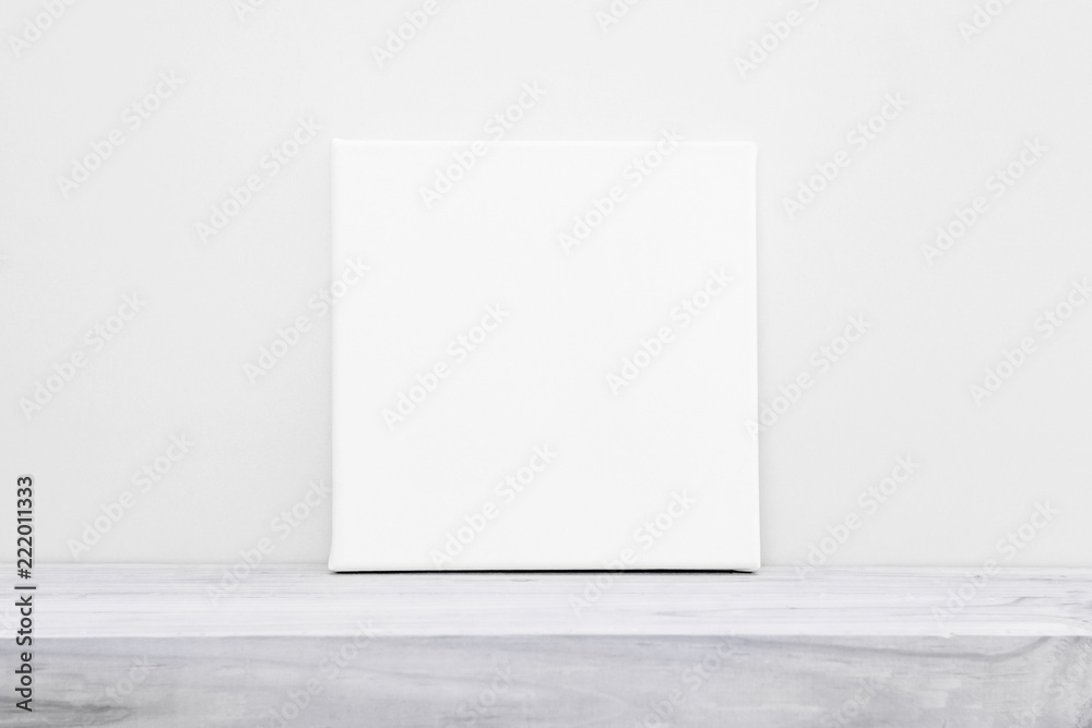 Mock-up poster frame. Blank square canvas on table. - obrazy, fototapety, plakaty 