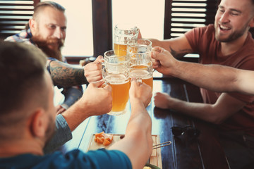 Sticker - Friends clinking glasses with beer in pub