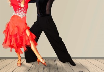 Man and a woman dancing  Salsa on background