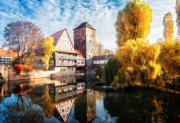 Wall Mural - old town of nuremberg with half-timbered houses over pegnitz river, germany at fall, retro toned