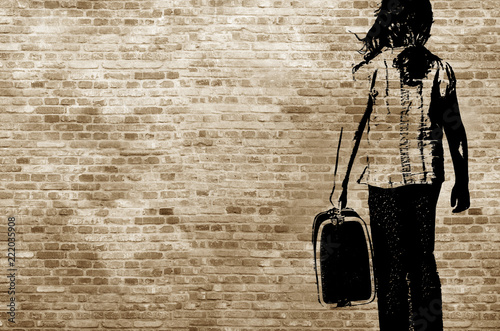 Fotografía Graffiti/shadow on a brickwall showing a refugee girl walking with her suitcase