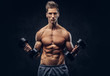 © Fxquadro - Handsome shirtless man with stylish hair and muscular ectomorph body doing the exercises with dumbbells.