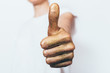 © progressman - Female hand painted in golden showing thumb up