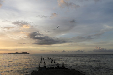 Sunset from a pier on the beach