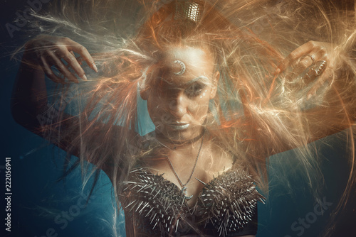 Fotomural Strong tribal woman warrior, moon goddess or a priestess