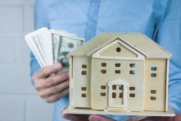 Wall Mural - house and money in hand