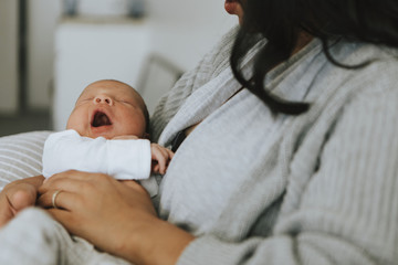 Wall Mural - mother holding her infant baby
