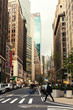 Broadway street in Manhattan's midtown by early evening,  New York City, United States. Toned image