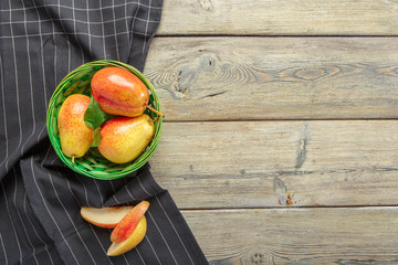 Ripe pears on rustic wooden table