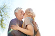 © Pixel-Shot - Mature couple resting in park on spring day