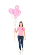 young woman holding bunch of pink balloons and smiling at camera isolated on white, breast cancer concept