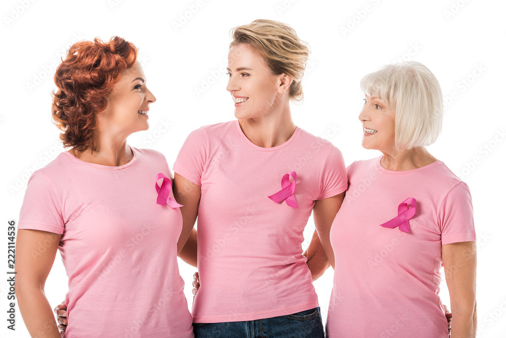 women with pink ribbons standing together and smiling each other ...