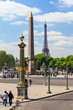 Tourist look around at Place de la Concorde in Paris, France, with the Eiffel tower in the background, on April 14, 2014
