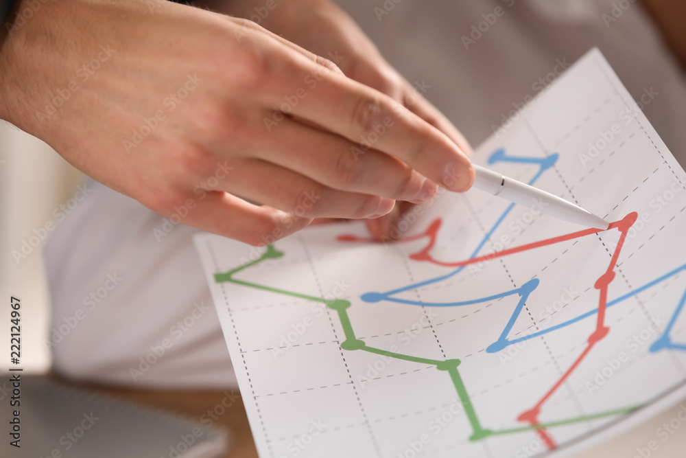Man with diagram during business meeting in office