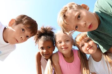 Wall Mural - Cute little children outdoors, bottom view