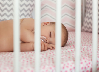 Wall Mural - Cute little baby sleeping in crib