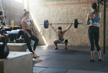 Wall Mural - Sport. Crossfit Athletes At Workout Gym