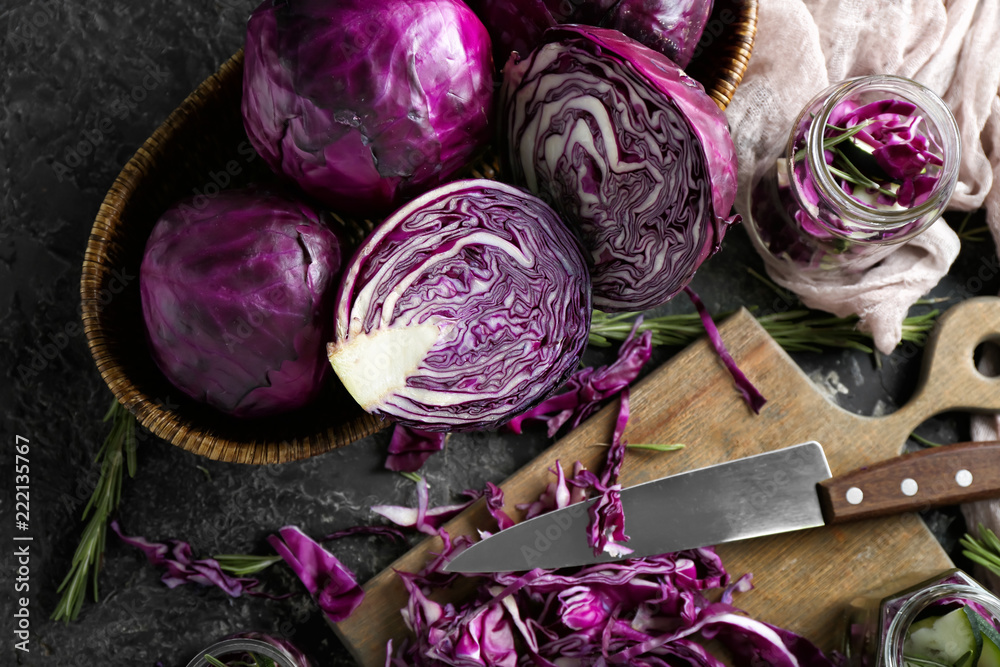Composition with cut red cabbage on grunge table - obrazy, fototapety, plakaty 