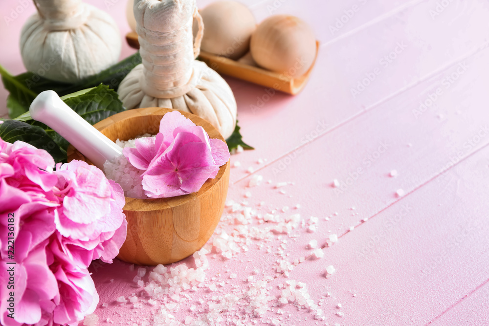 Spa composition with hydrangea flowers and sea salt on color table