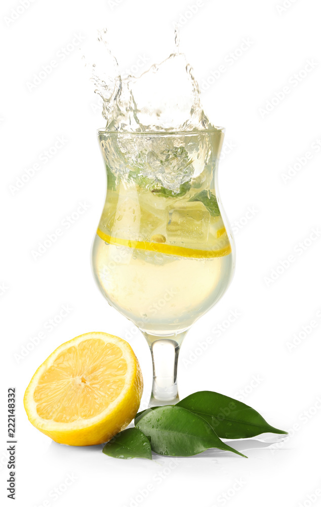 Glass of fresh lemonade with splashes on white background