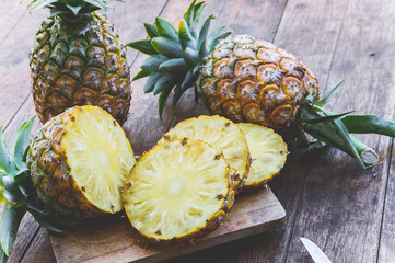 Wall Mural - pineapple fruit on wood table