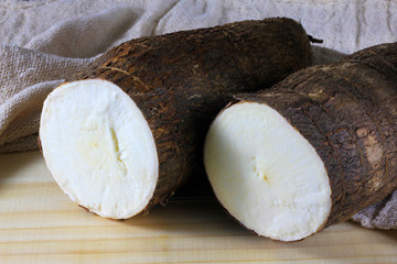 closeup two diced manioc on wooden table