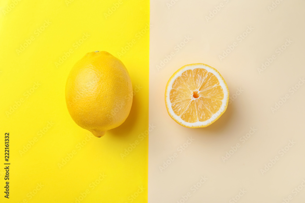 Ripe lemon and slice on color background