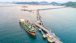 © MAGNIFIER - oil tanker, gas tanker in the high sea.Refinery Industry cargo ship,aerial view,Thailand, in import export, LPG,oil refinery, Logistics and transportation with working crane bridge in harbor