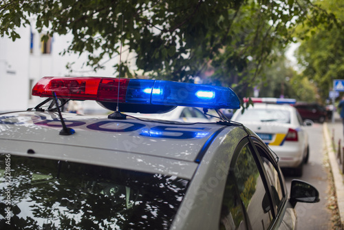 Fototapeta police cars with flashers on
