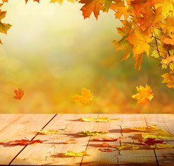 Autumn maple leaves on wooden  table.Falling leaves natural background.