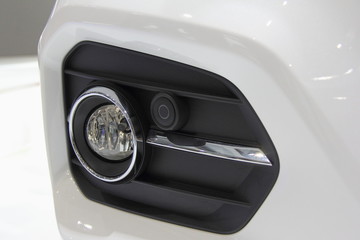 Car fog light, front view camera and Parking sensor close up