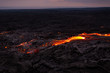 Overview of glowing lava flow from Puu Oo in the evening on the Pali in Kalapana, Big Island, Hawaii.