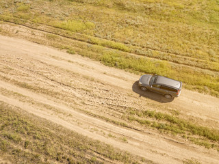 aerial off-road truck in the summer green field  f