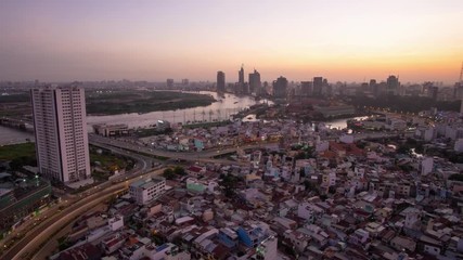 Wall Mural - Timelapse landscape sunrise to the morning of Ho Chi Minh city or Sai Gon, Vietnam. Royalty high-quality free stock footage time lapse of center city in dawn sky.  Timelapse or time lapse is fast