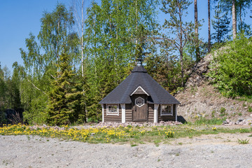 Wall Mural - A fairy-tale house in the glade of dandelions in Ruskeala