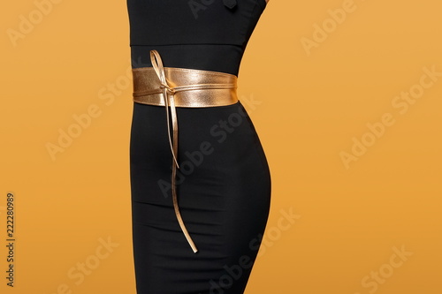 black dress with gold belt