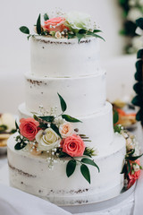 wedding cake with red and white flowers