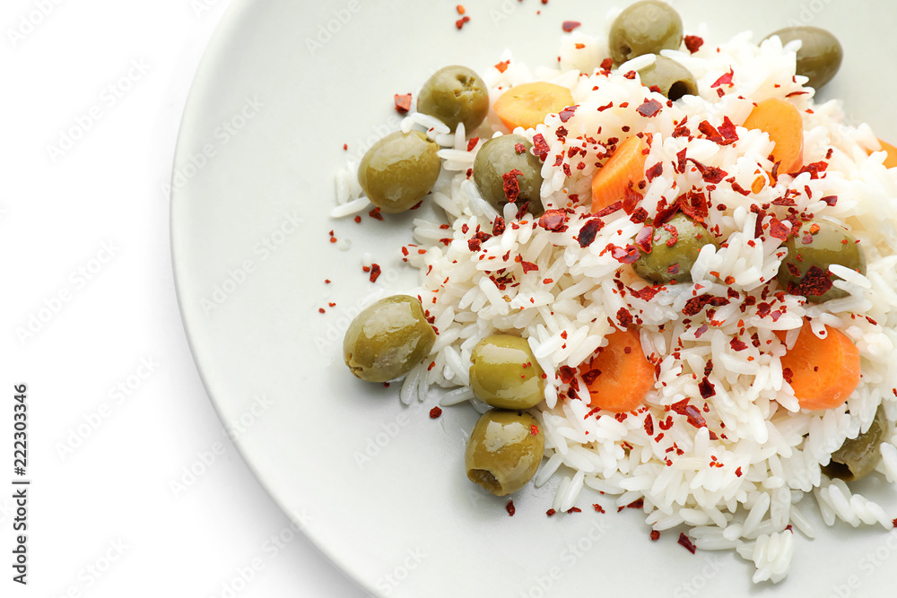 Plate with tasty boiled rice and vegetables on white background, closeup