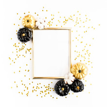 Gold Frame Decorated With Black And Gold Halloween Pumpkin And Tinsel Isolated On White Background. Halloween Or New Year Frame Composition. Flat Lay, Top View.