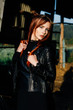 © Vladimir - portrait of a cute red-haired girl in a black leather jacket at sunset
