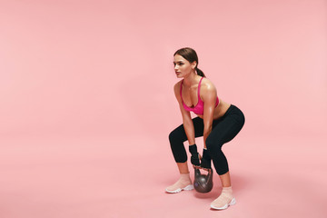 Wall Mural - Sport Training. Athletic Woman Doing Squats With Dumbbell