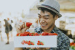 © Rawpixel.com - Man buying strawberries at a farmers market
