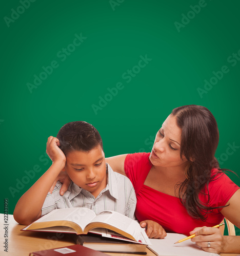 Blank Chalk Board Behind Hispanic Young Boy and Famale Adult Studying